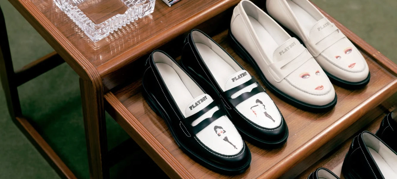 Loafers displayed on a wooden table